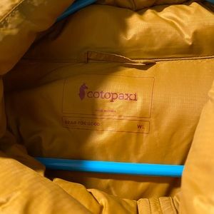 Womens size large Cotopaxi down jacket, bronze/port color, never worn